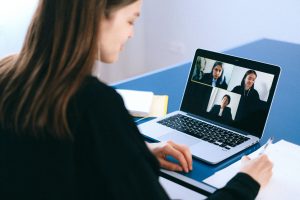 Woman in a meeting to show productivity principles for remote teams